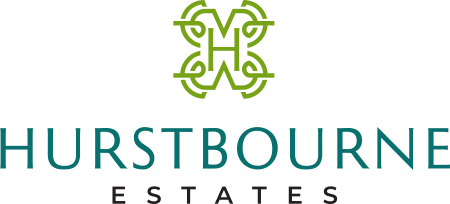 Badge logo for Hurstbourne Estates, logo then title